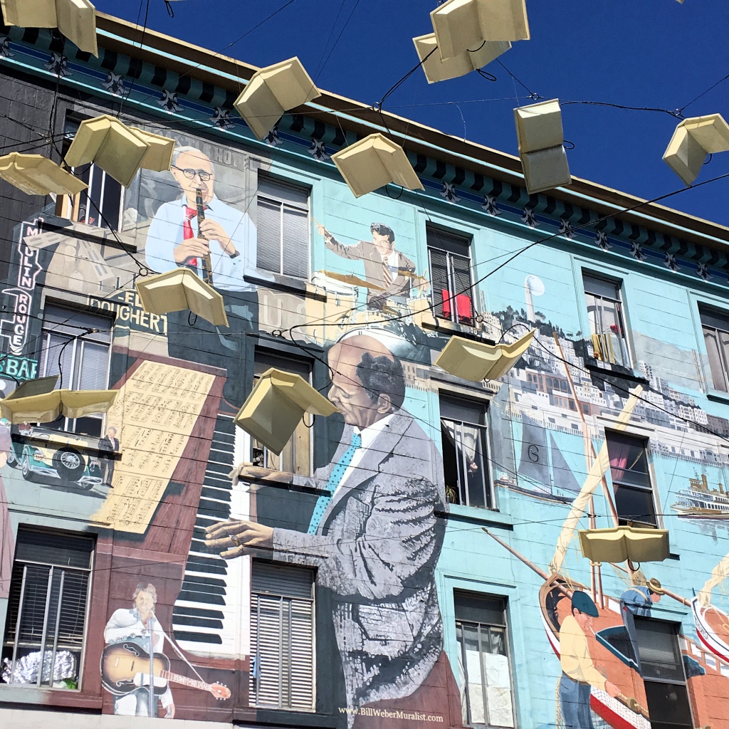 Wall mural with flying books in North Beach